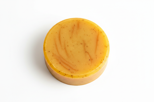 1.5 oz bar of honey turmeric soap that is a circle